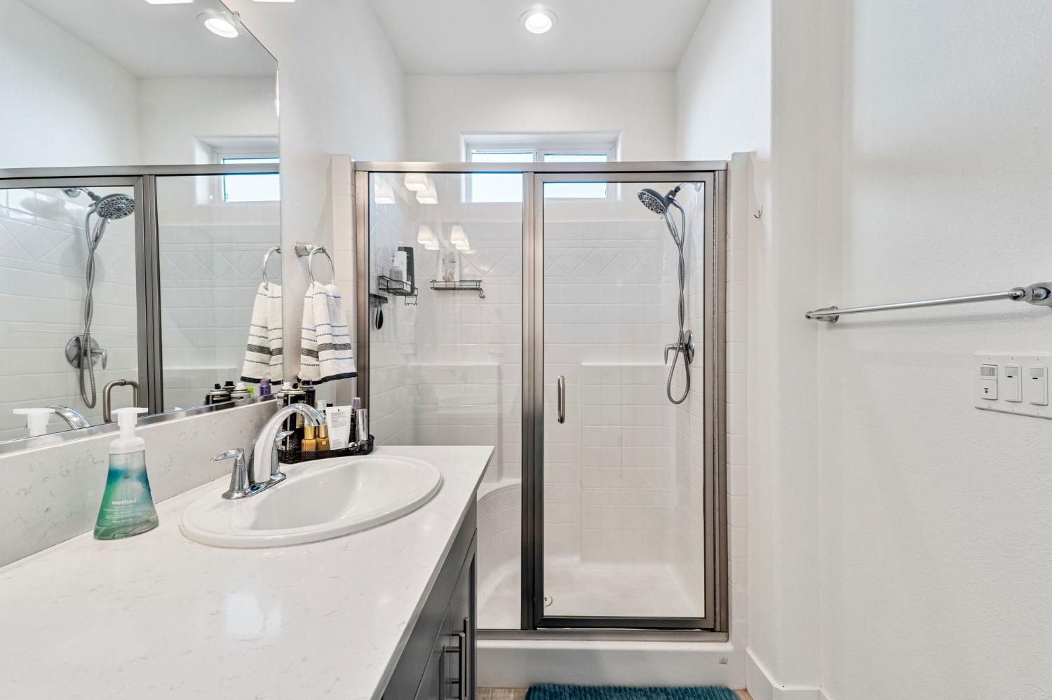 4218 Oak Knoll Road Madera, CA 93636 - Photo 20 of 37 a bathroom with a sink and a mirror