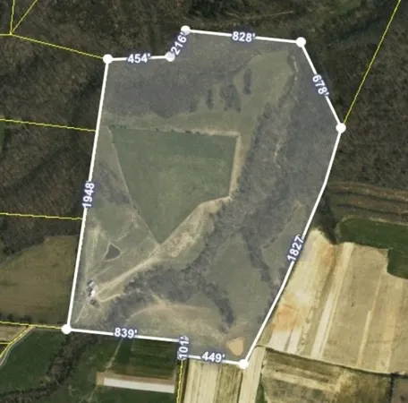 a view of a field with an outdoor space