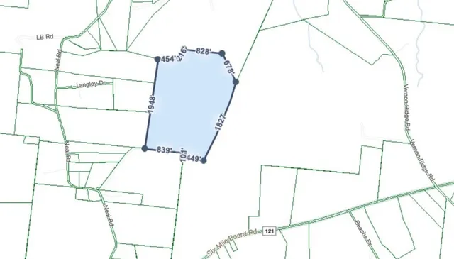 a view of a field with an outdoor space