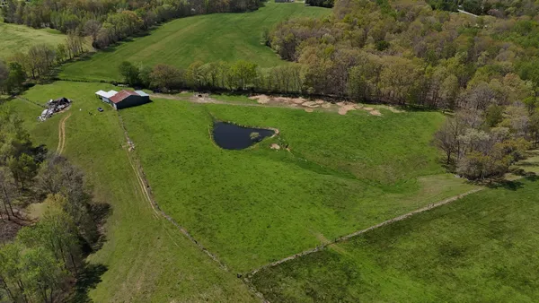 a view of a yard with an outdoor seating