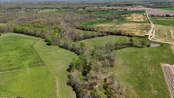 a view of a lake with a yard