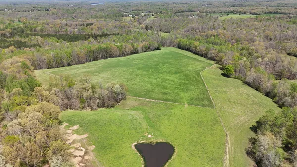 a view of a lake with a yard