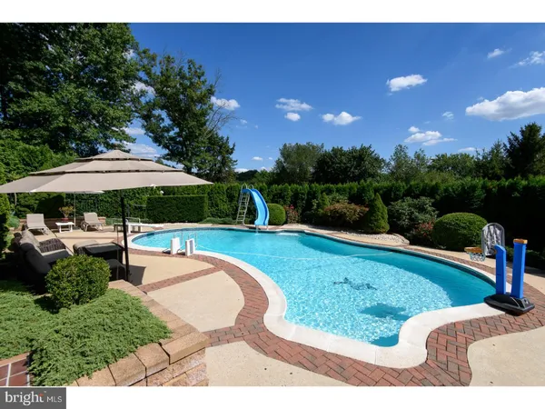 a view of a swimming pool with a patio