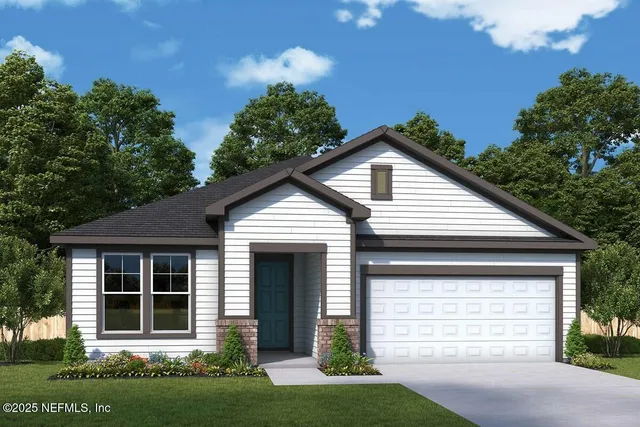 a front view of a house with a garden and plants