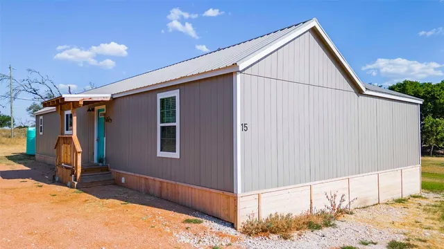 a view of swimming pool with a back yard