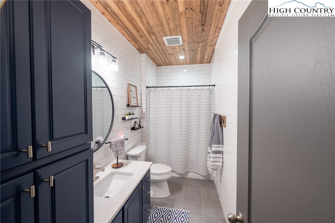 202 Herman Lane Boone, NC 28607 - Photo 31 of 45 a bathroom with a sink a toilet and shower
