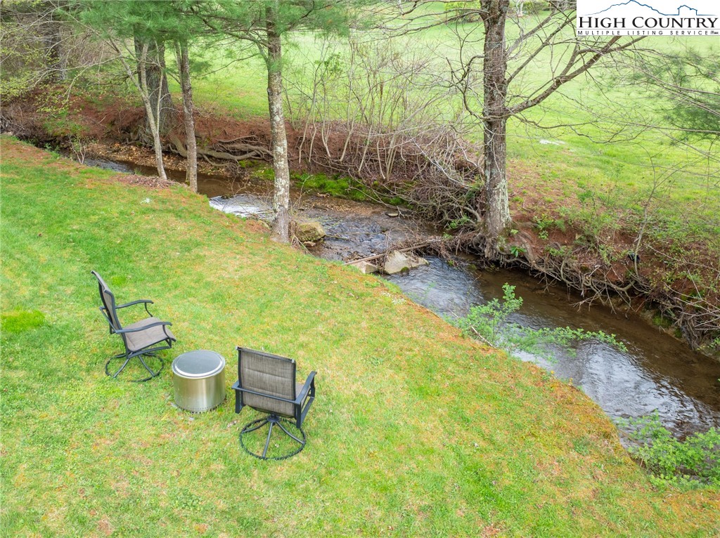 202 Herman Lane Boone, NC 28607 - Photo 4 of 45 a backyard of a house with table and chairs