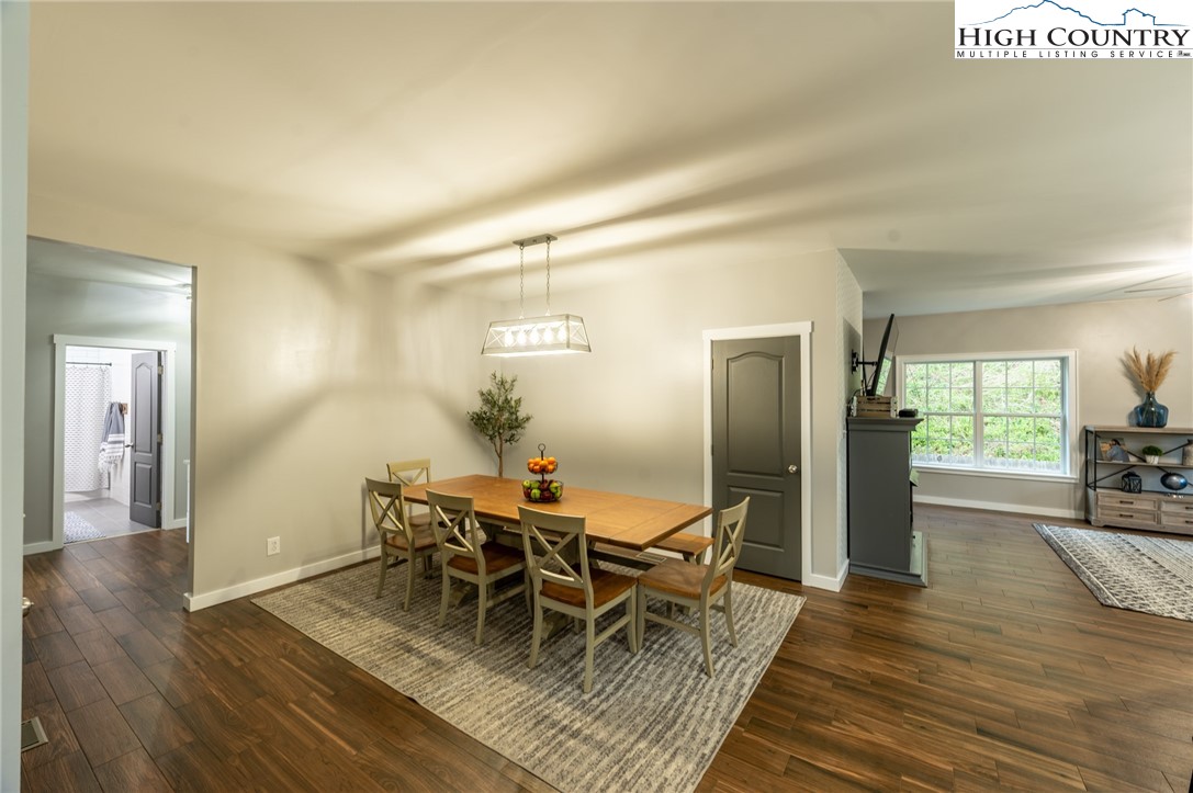 202 Herman Lane Boone, NC 28607 - Photo 9 of 45 a view of a dining room with furniture and wooden floor