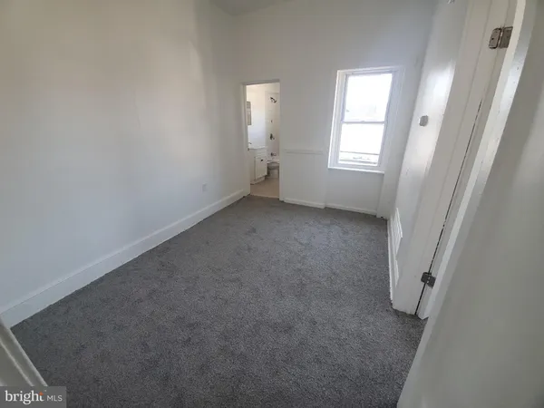 a bathroom with a double vanity sink toilet and shower