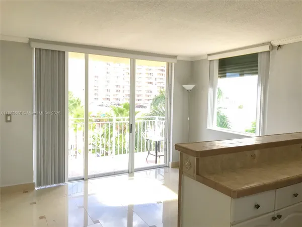 a view of an empty room with a window