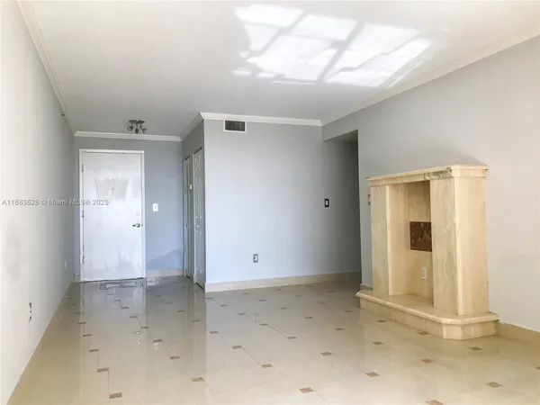 an empty room with a empty space and windows