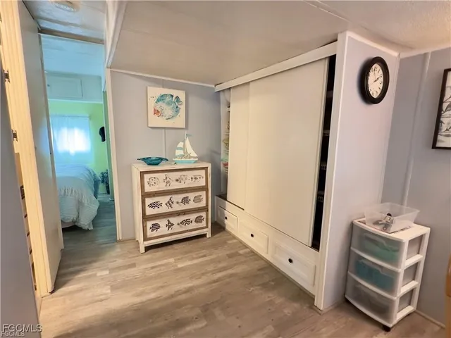 a bed in a bathroom next to a window