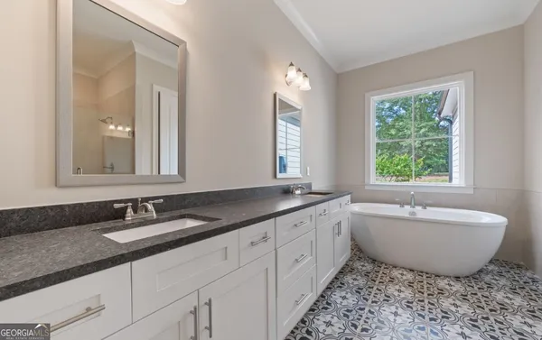 a kitchen with stainless steel appliances granite countertop a sink and cabinets
