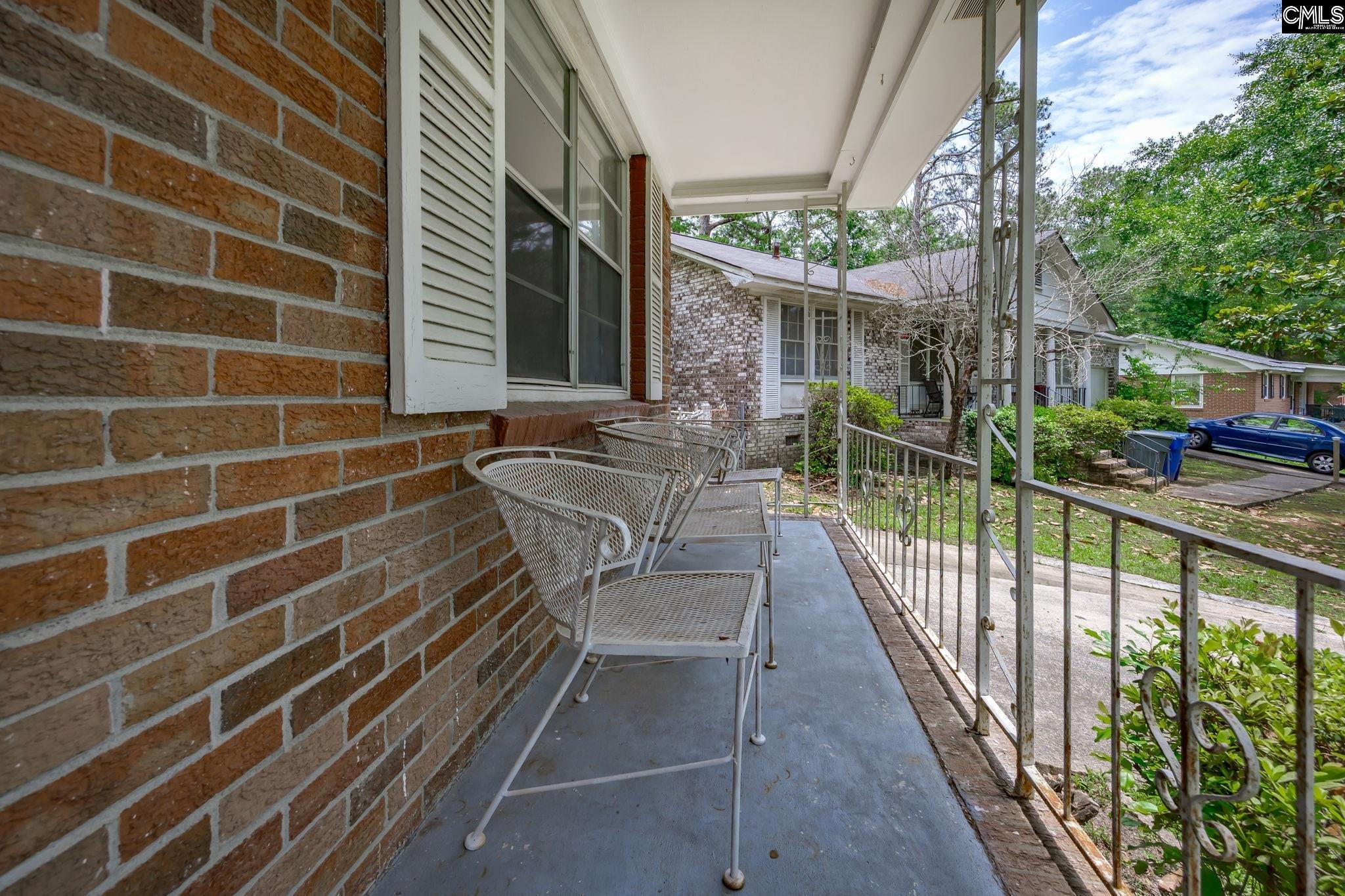 5666 Middleton Court Columbia, SC 29203 - Photo 7 of 42 a view of a balcony with floor to ceiling windows and wooden fence