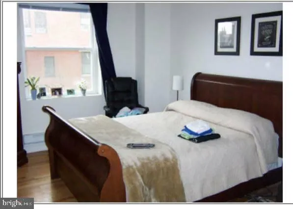 a view of an empty room and wooden floor