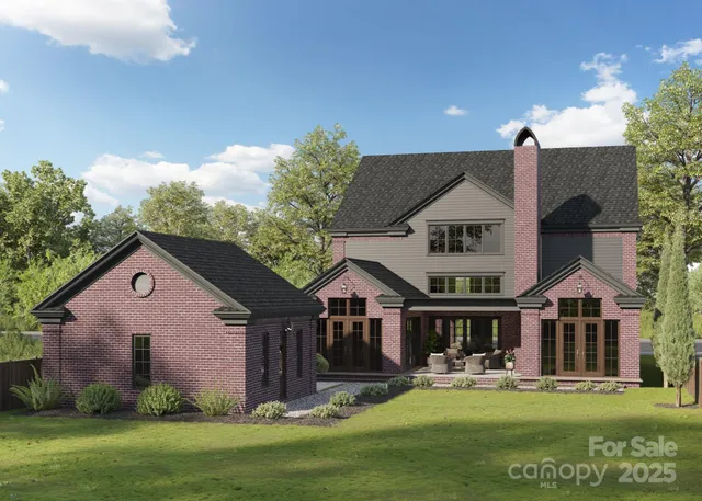 a front view of house with yard and green space