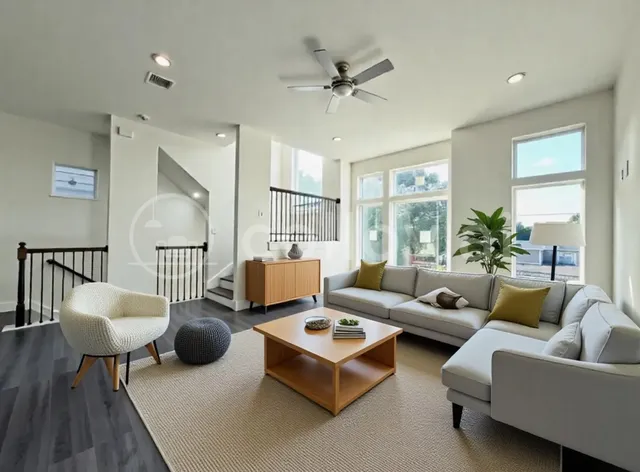 a living room with furniture and a large window