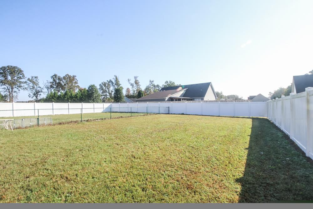 1919 Hills Chapel Road Manchester, TN 37355 - Photo 3 of 17 Rear Fenced yard is sectioned off for kids and dogs. Chain length can easily be removed.