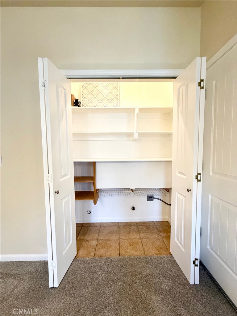 1037 Mark Twain Road Angels Camp, CA 95222 - Photo 25 of 52 a view of walk in closet with empty racks