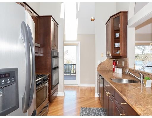 818 Long Pond Road Plymouth, MA 02360 - Photo 17 of 30 a kitchen with stainless steel appliances granite countertop a refrigerator and a sink