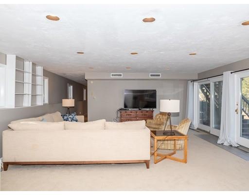 818 Long Pond Road Plymouth, MA 02360 - Photo 23 of 30 a living room with furniture a flat screen tv and a large window