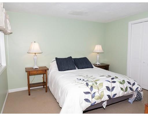 818 Long Pond Road Plymouth, MA 02360 - Photo 26 of 30 a bedroom with a bed and a lamp