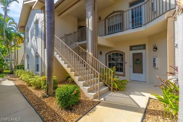 a view of front door and potted plants