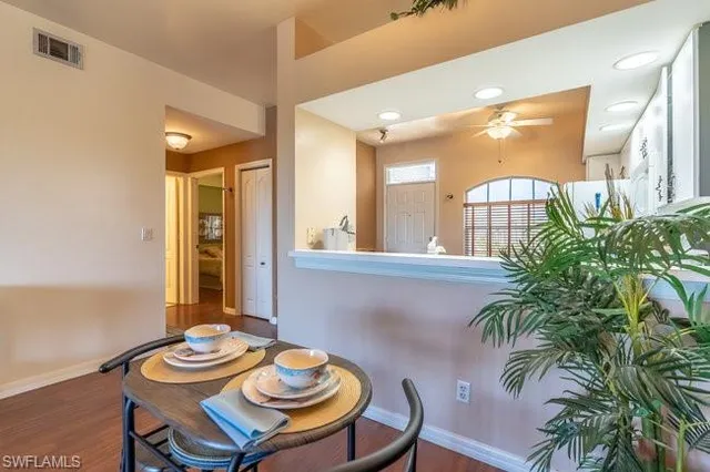 a view of a dining room with furniture and window