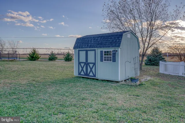 a bathroom with double sink and a mirror