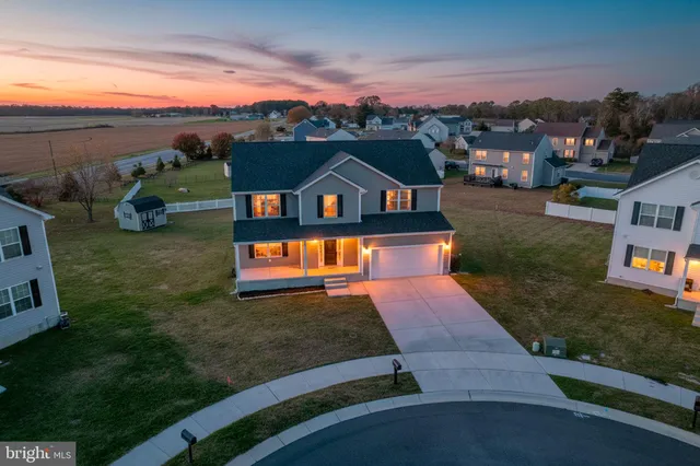an aerial view of a house with a ocean view