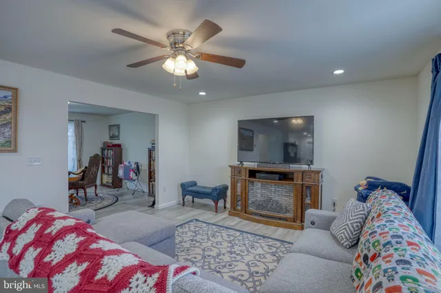 a kitchen with kitchen island granite countertop a sink cabinets and stainless steel appliances