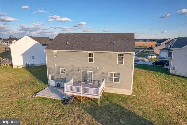 a spacious bedroom with a large bed and a dresser