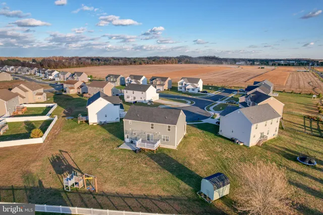 an aerial view of a house with a garden