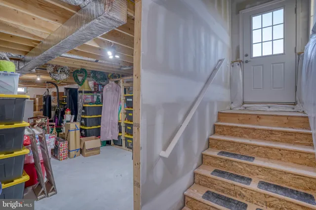 a view of a livingroom with furniture and workspace
