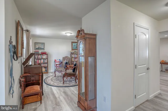 a kitchen with refrigerator and cabinets