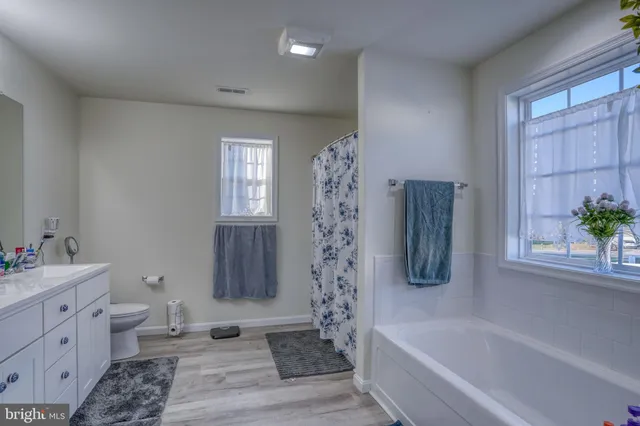 a utility room with closet dryer and washer