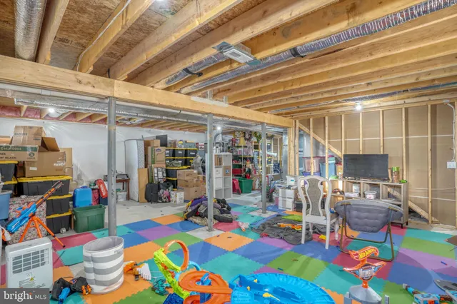 a storage room with furniture and a ceiling fan