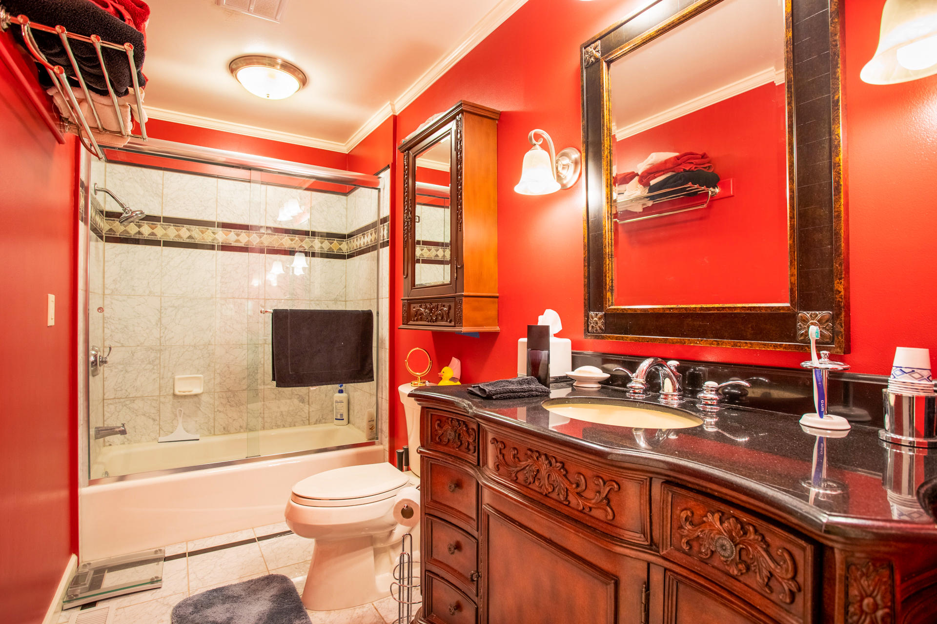 8656 Valley View Road Redding, CA 96001 - Photo 16 of 50 a bathroom with a sink a toilet and shower
