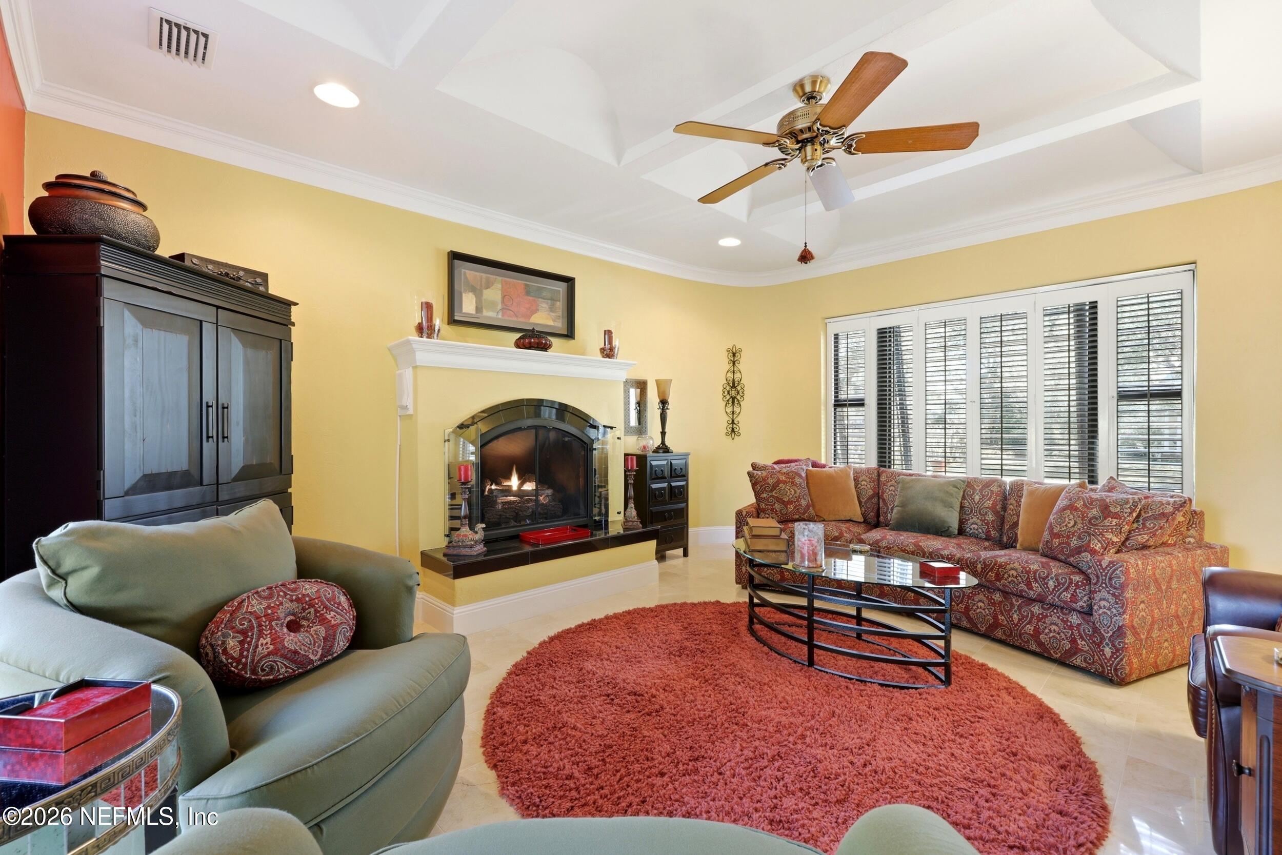 10 Lydia Lane St. Augustine, FL 32080 - Photo 11 of 119 a living room with furniture a rug and a fireplace