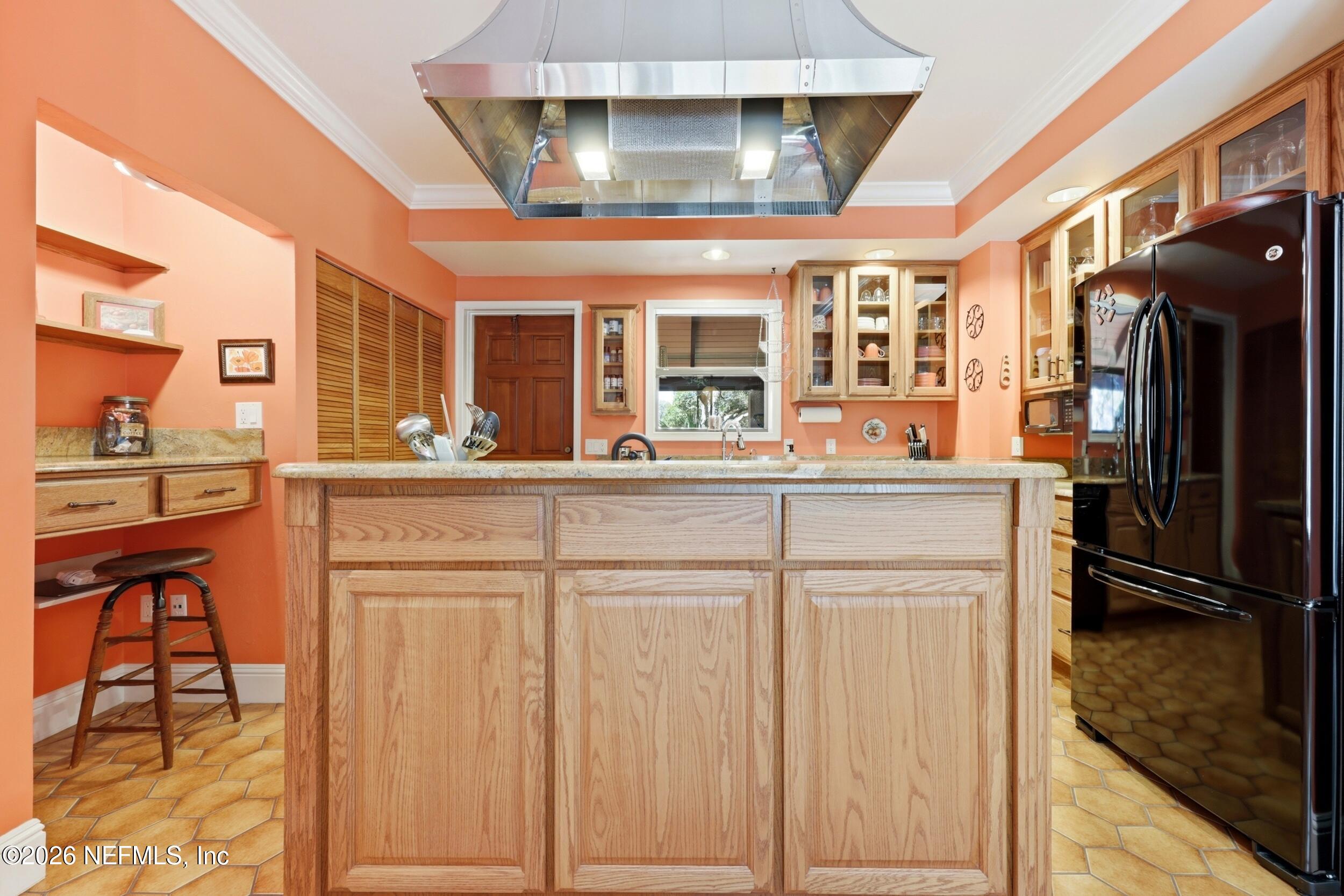 10 Lydia Lane St. Augustine, FL 32080 - Photo 16 of 119 a kitchen with stainless steel appliances granite countertop a refrigerator and a stove