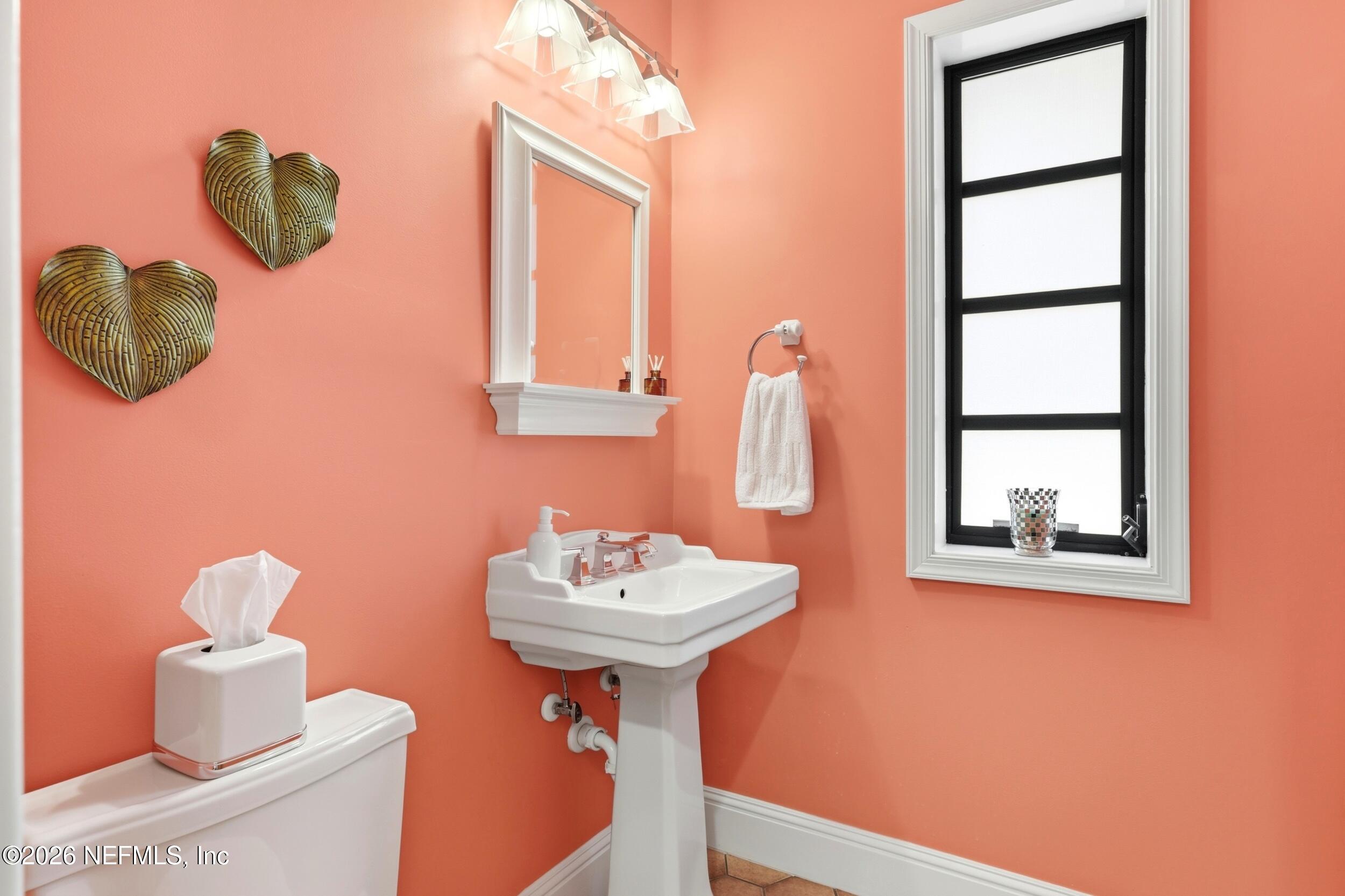 10 Lydia Lane St. Augustine, FL 32080 - Photo 26 of 119 a bathroom with a sink mirror and vanity