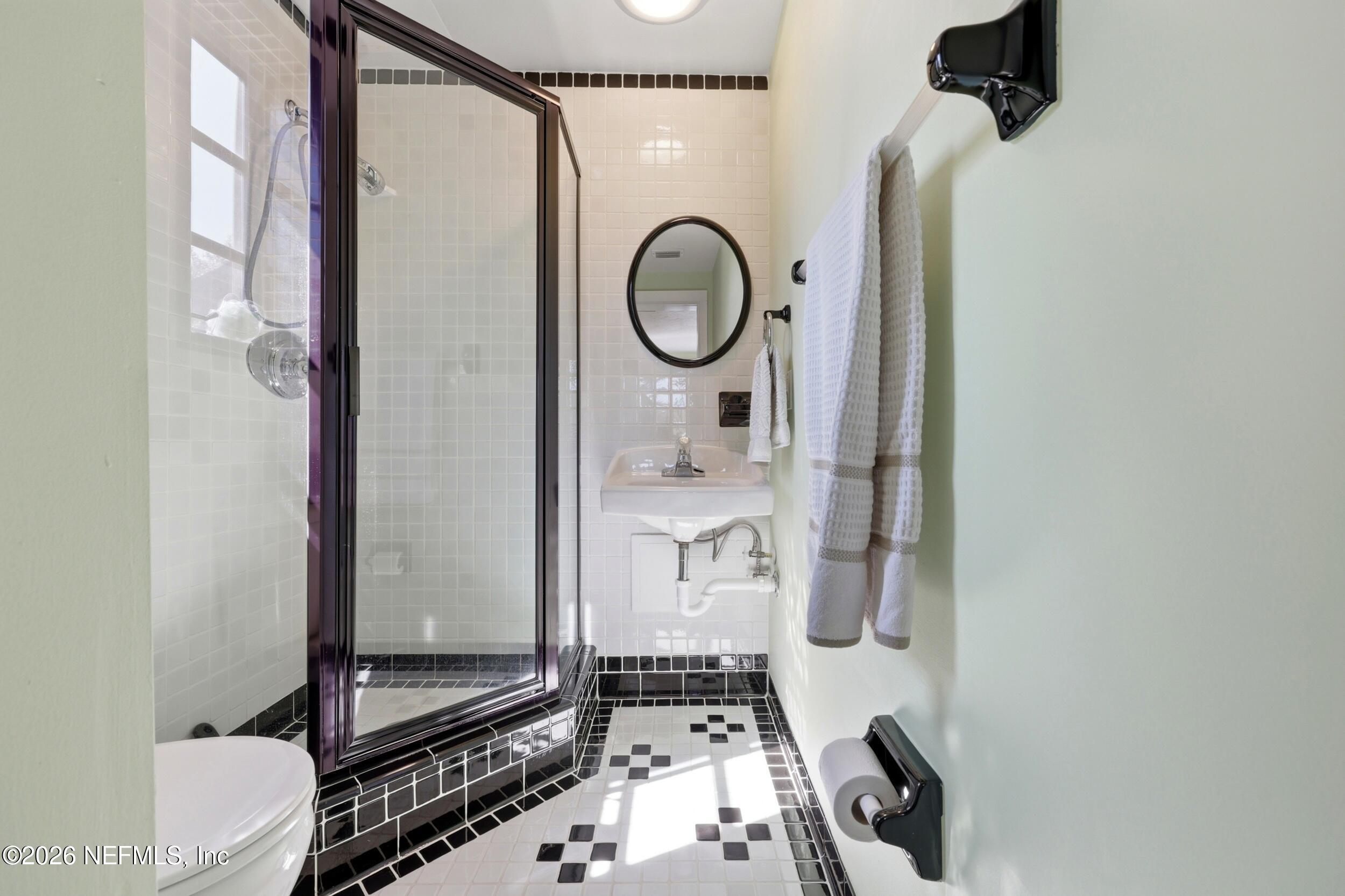 10 Lydia Lane St. Augustine, FL 32080 - Photo 40 of 119 a bathroom with a granite countertop shower a mirror and a toilet