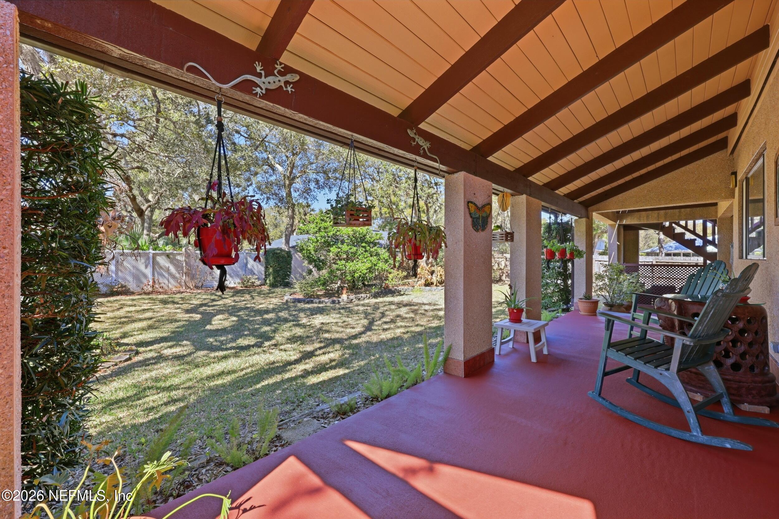 10 Lydia Lane St. Augustine, FL 32080 - Photo 59 of 119 a view of a patio with a table chairs and a backyard