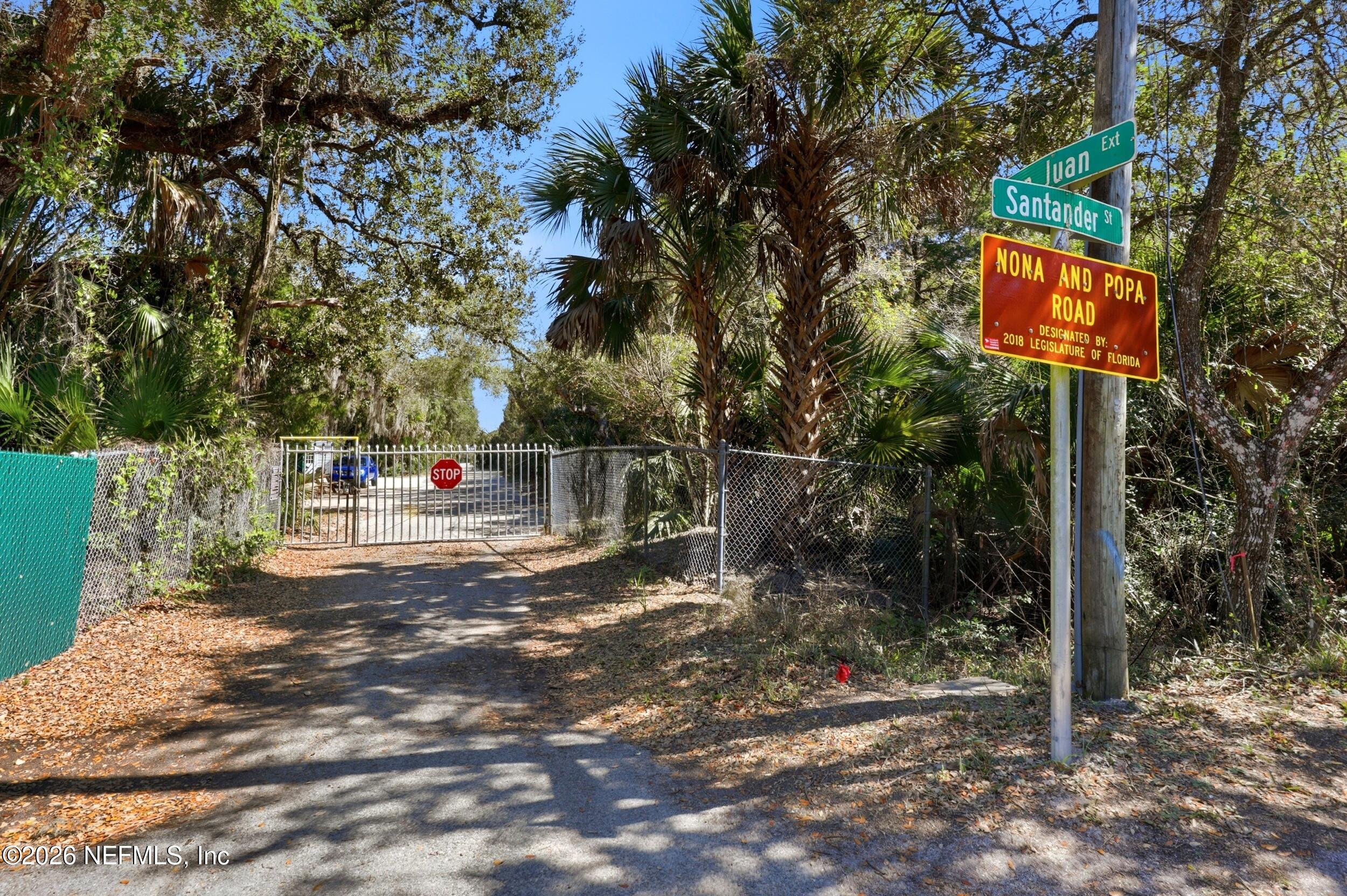 10 Lydia Lane St. Augustine, FL 32080 - Photo 69 of 119 a street sign on a sidewalk next to a road