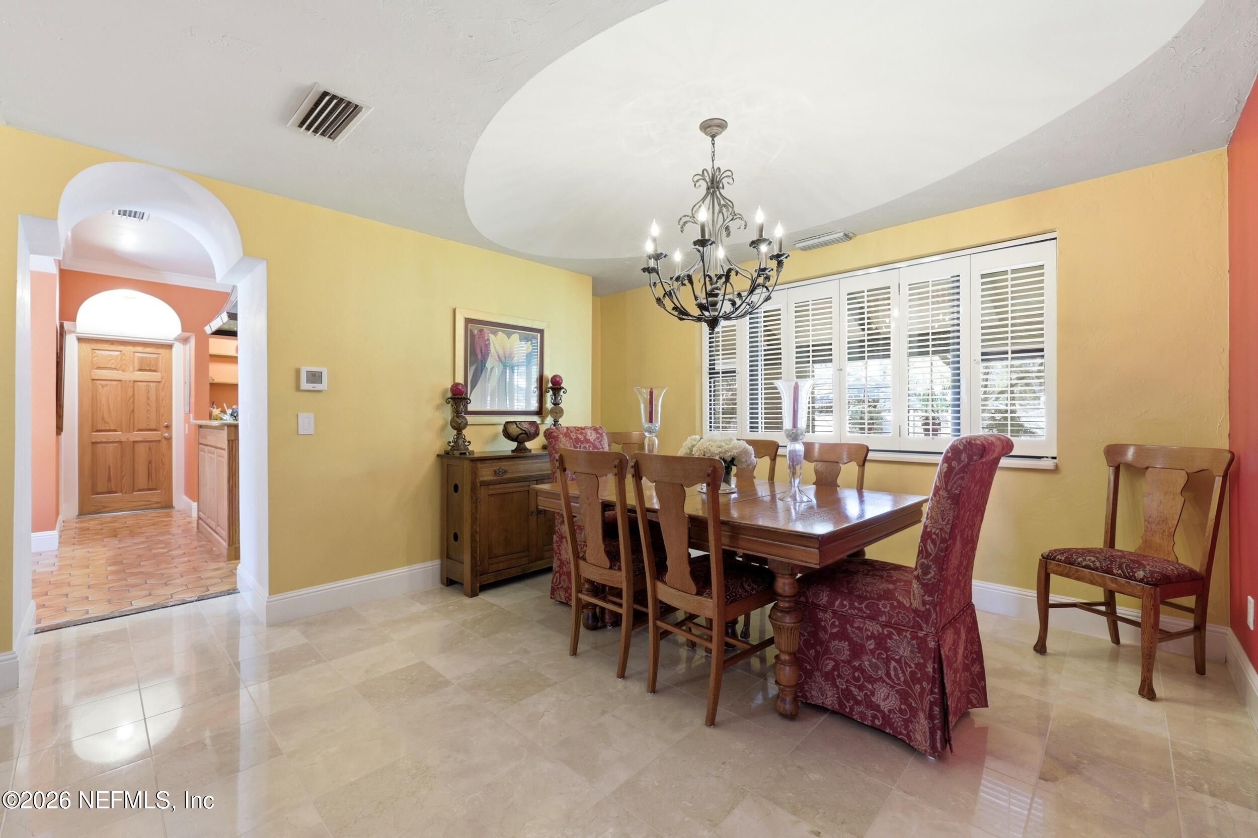 10 Lydia Lane St. Augustine, FL 32080 - Photo 8 of 119 a view of a dining room with furniture and chandelier