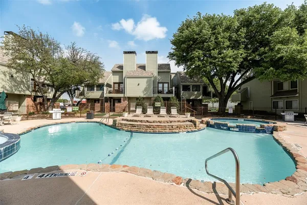 a swimming pool with outdoor seating and yard