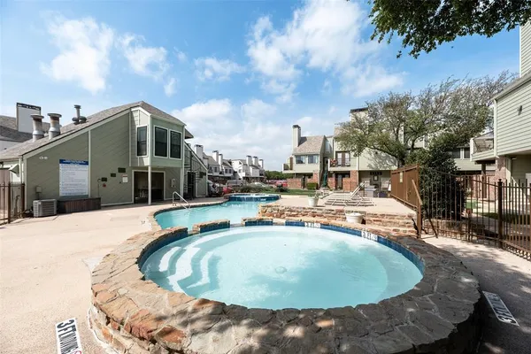 a view of a house with backyard porch and sitting area
