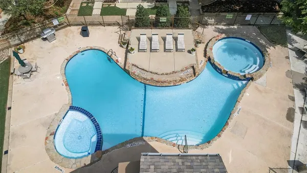an aerial view of a swimming pool and outdoor space