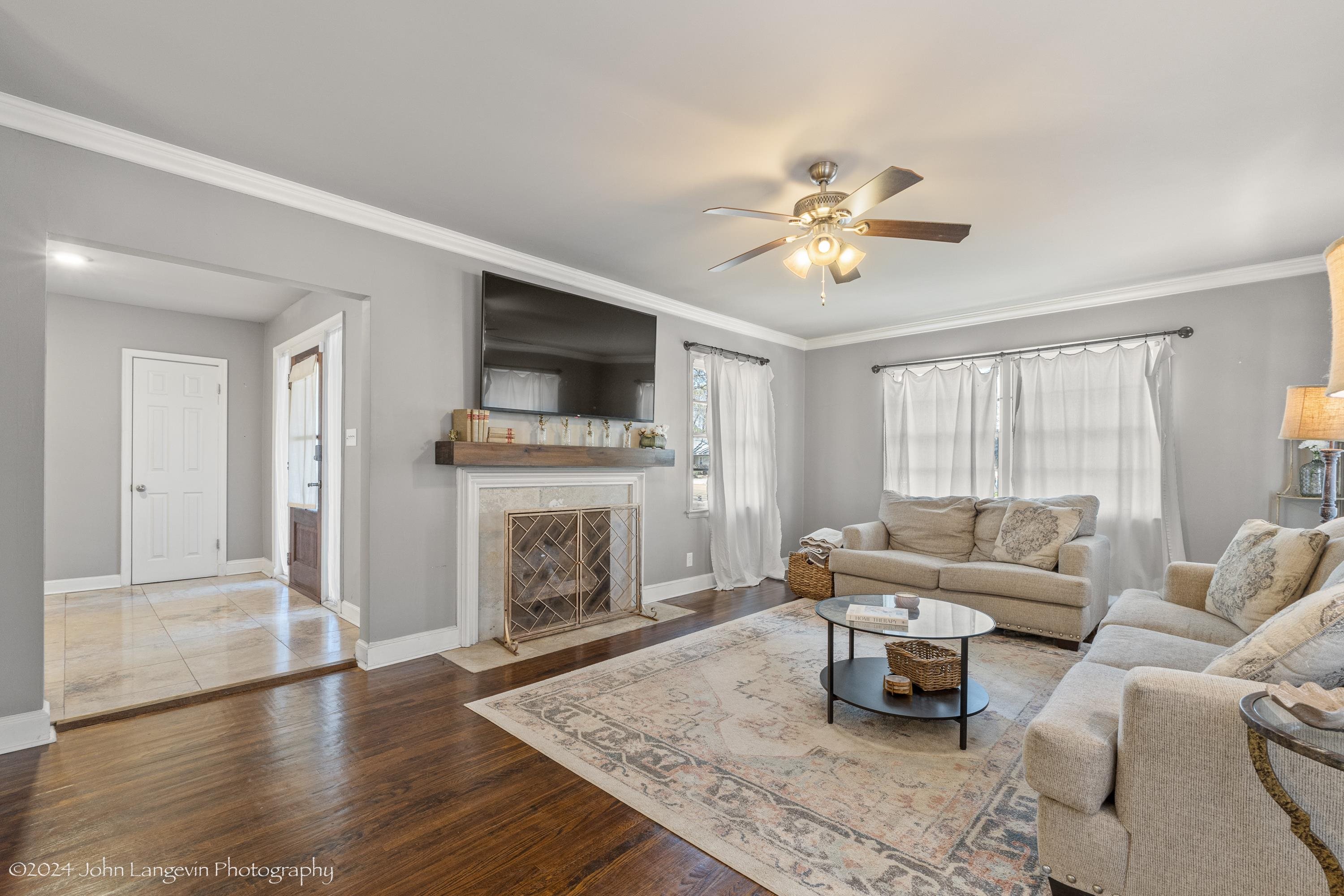 3381 Walnut Grove Road Memphis, TN 38111 - Photo 12 of 25 a living room with furniture and a fireplace