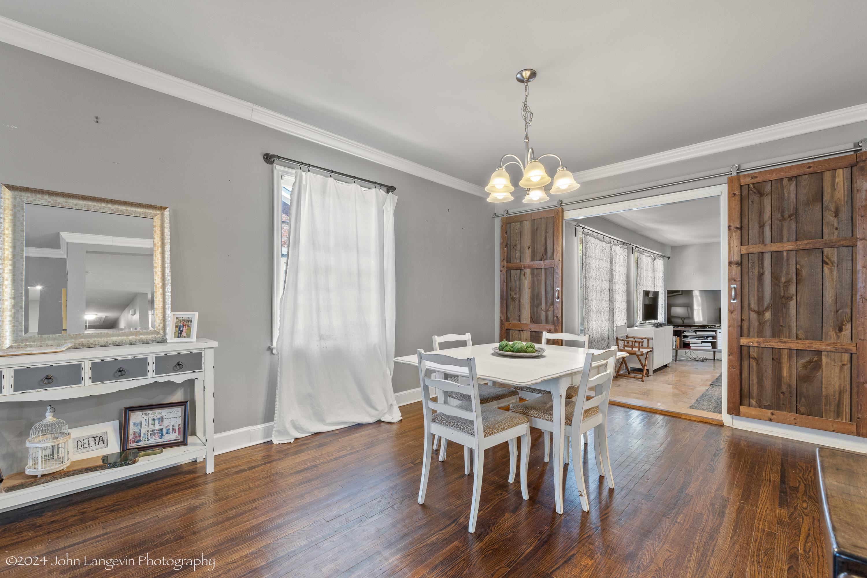 3381 Walnut Grove Road Memphis, TN 38111 - Photo 15 of 25 a view of a dining room with furniture and wooden floor
